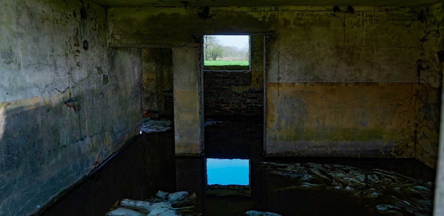 Bunker with the floor covered in water.